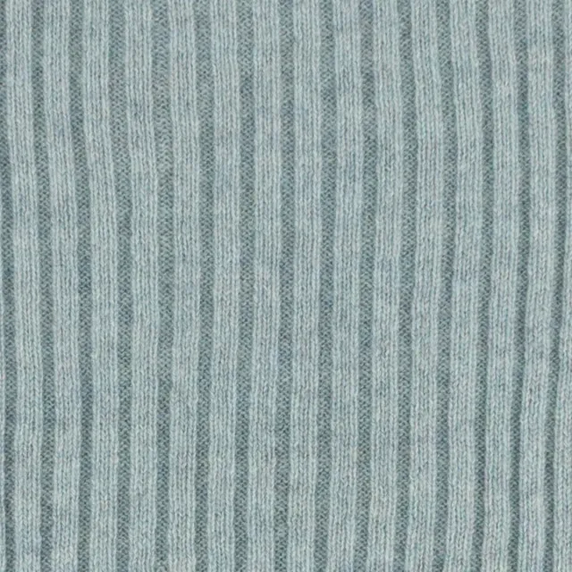Close-up of fine vertical ribs in pale silver-grey cashmere.