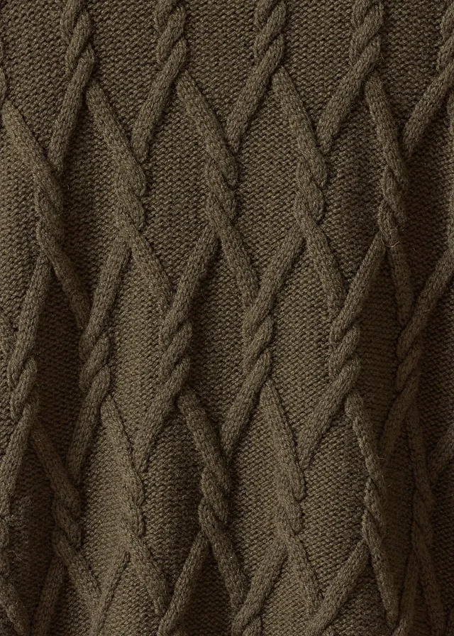 Close-up of rope cable columns in dark olive-brown knitted fabric.