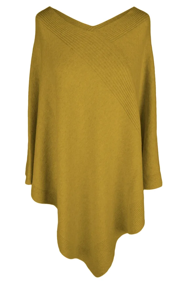 Mustard cashmere poncho with an asymmetric drape.